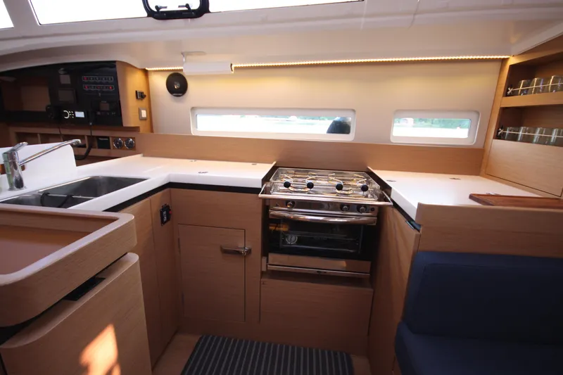 Slide: The Image of Modern kitchen in 2022 Jeanneau Sun Odyssey 410 yacht with stove and sink. - 22