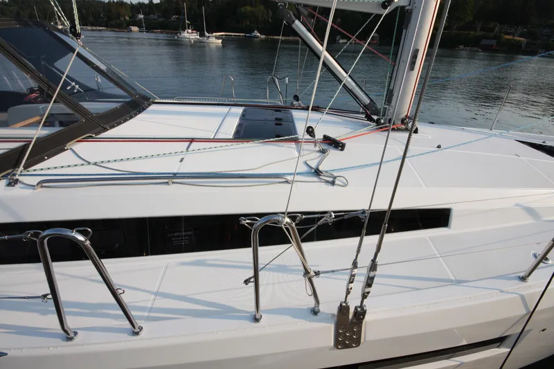 Slide: The Image of Jeanneau Sun Odyssey 410 sailboat deck, 2022 model, moored on calm water. - 32