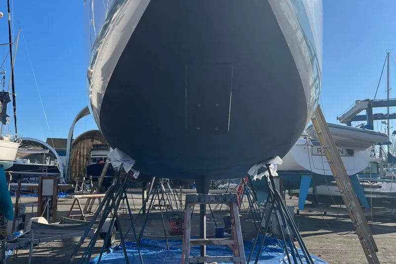 Slide: The Image of 2022 Jeanneau Sun Odyssey 410 sailboat in dry dock, viewed from below. - 42