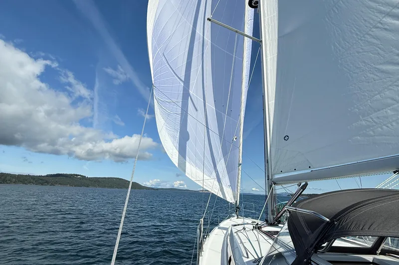 Slide: The Image of Jeanneau Sun Odyssey 410 sailing on open water under clear blue skies, 2022 model. - 45