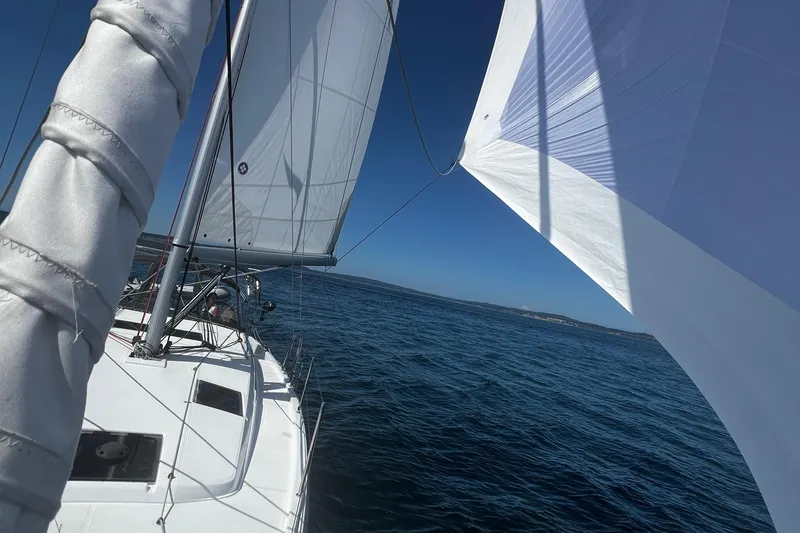 Slide: The Image of Sailing Jeanneau Sun Odyssey 410, 2022 model, on open sea with clear blue skies. - 46