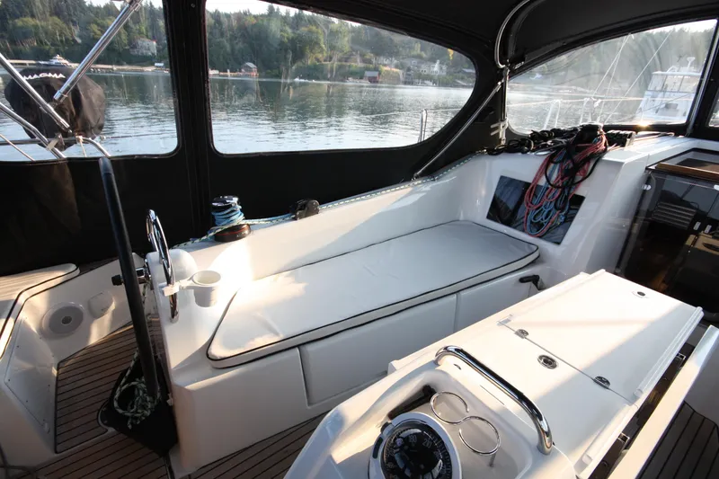 Slide: The Image of Jeanneau Sun Odyssey 410 cockpit, 2022 model, featuring sleek design and comfortable seating. - 7