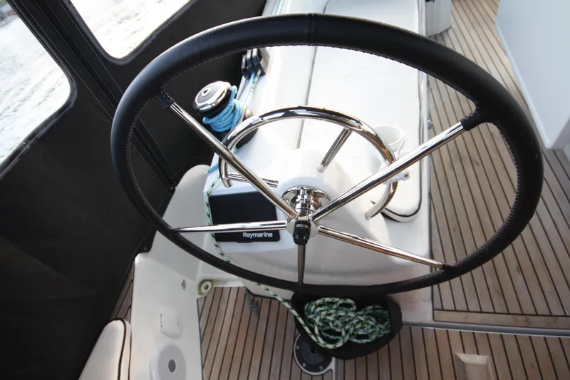 Slide: The Image of Steering wheel of 2022 Jeanneau Sun Odyssey 410 sailboat with Raymarine equipment. - 9