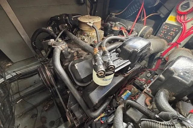 Slide: The Image of Engine compartment of a 1992 Sea Ray 330 Sundancer boat, showing detailed components. - 22