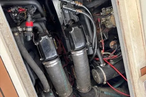 Slide: The Image of Engine compartment of a 1992 Sea Ray 330 Sundancer with visible components and wiring. - 23