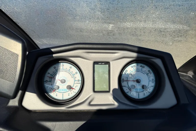 Slide: The Image of Dashboard of a 2018 Axis A20 boat with speedometer and tachometer gauges. - 15
