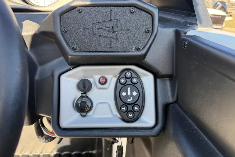 Slide: The Image of Control panel of a 2018 Axis A20 boat with buttons and a 12V socket. - 16