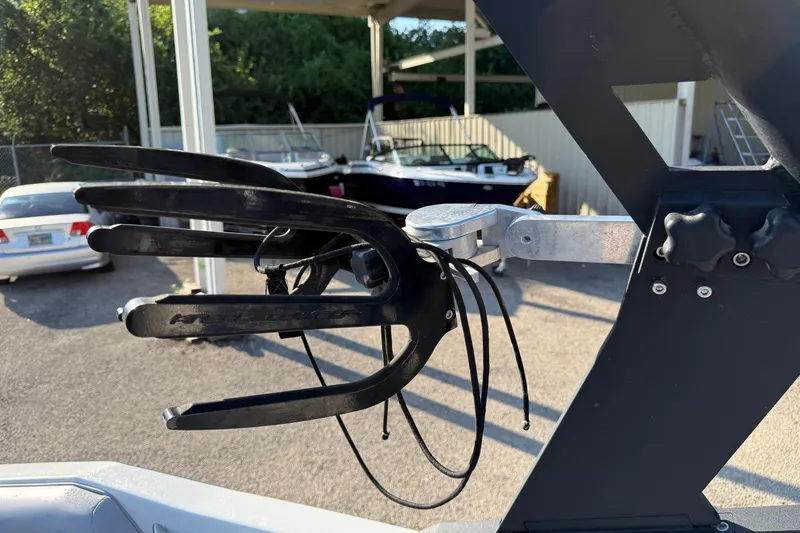 Slide: The Image of 2018 Axis A20 boat wakeboard rack in a sunny outdoor setting. - 18