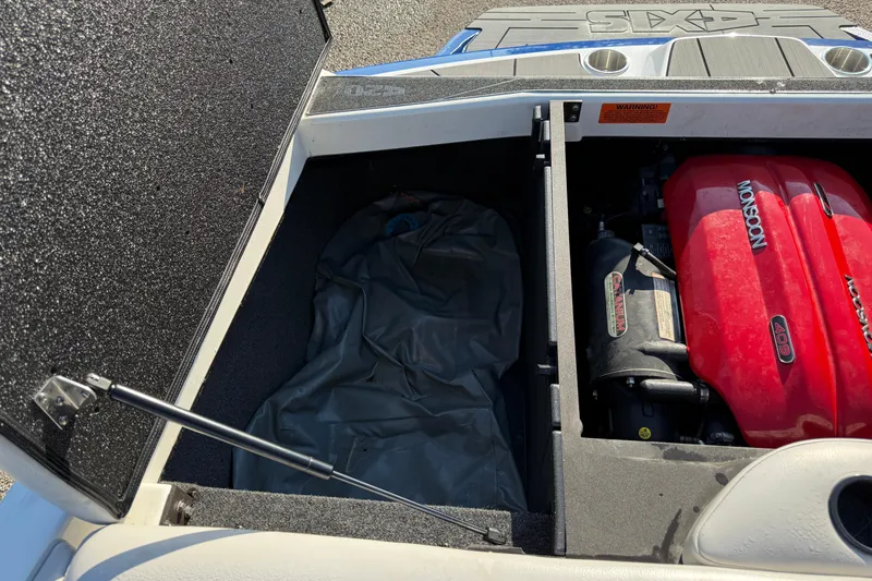 Slide: The Image of Open engine compartment of 2018 Axis A20 boat with Monsoon engine visible. - 21