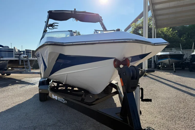 Slide: The Image of 2018 Axis A20 boat on trailer in sunny outdoor setting. - 8