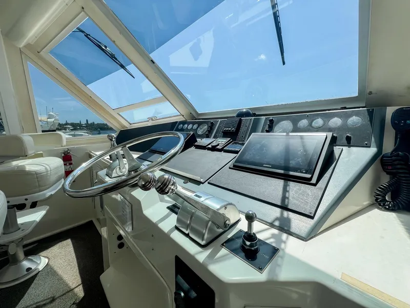 Slide: The Image of Helm of 1996 Viking 60 Cockpit Sport Yacht with modern navigation equipment. - 19