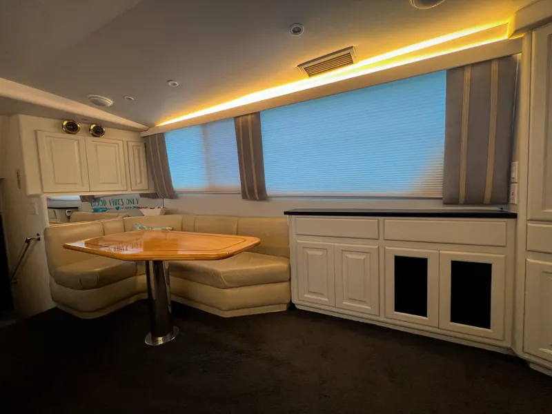 Slide: The Image of Interior of 1996 Viking 60 Cockpit Sport Yacht with cozy seating and elegant lighting. - 27