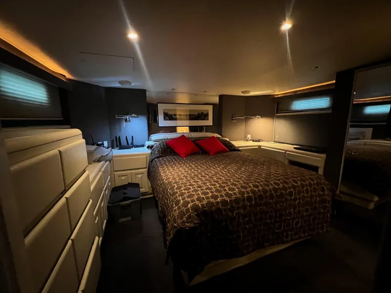 Slide: The Image of Luxurious bedroom in 1996 Viking 60 Cockpit Sport Yacht with modern decor and ambient lighting. - 30