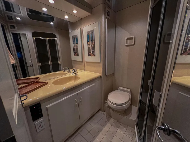 Slide: The Image of Luxurious bathroom in 1996 Viking 60 Cockpit Sport Yacht with modern fixtures and elegant decor. - 31