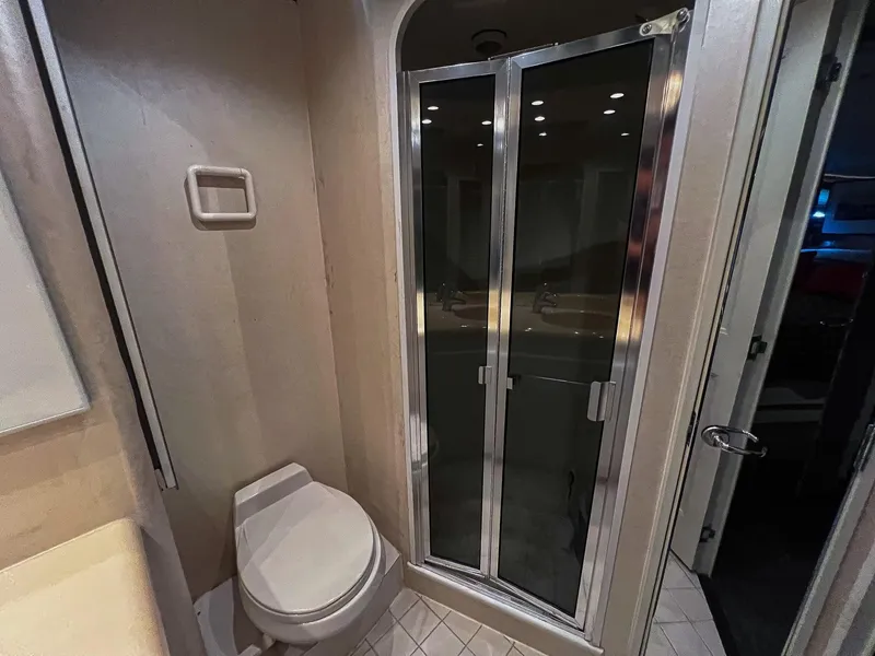 Slide: The Image of Bathroom interior of 1996 Viking 60 Cockpit Sport Yacht with shower and toilet. - 32