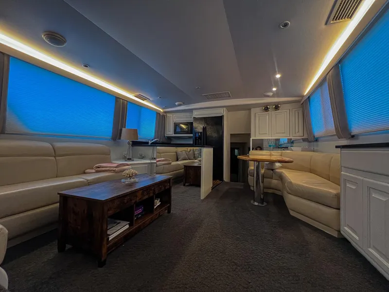 Slide: The Image of Luxurious interior of a 1996 Viking 60 Cockpit Sport Yacht with elegant seating and ambient lighting. - 33