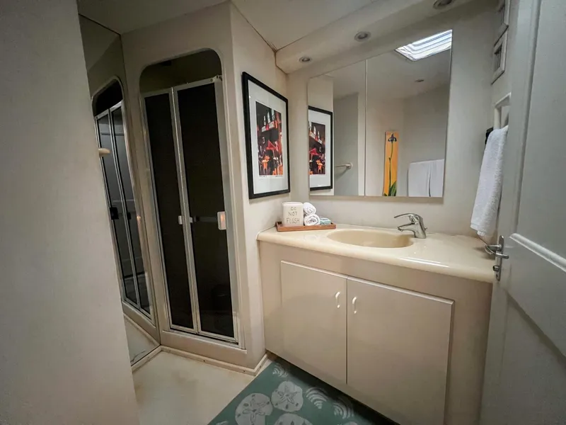 Slide: The Image of Bathroom interior of 1996 Viking 60 Cockpit Sport Yacht with shower and vanity. - 35