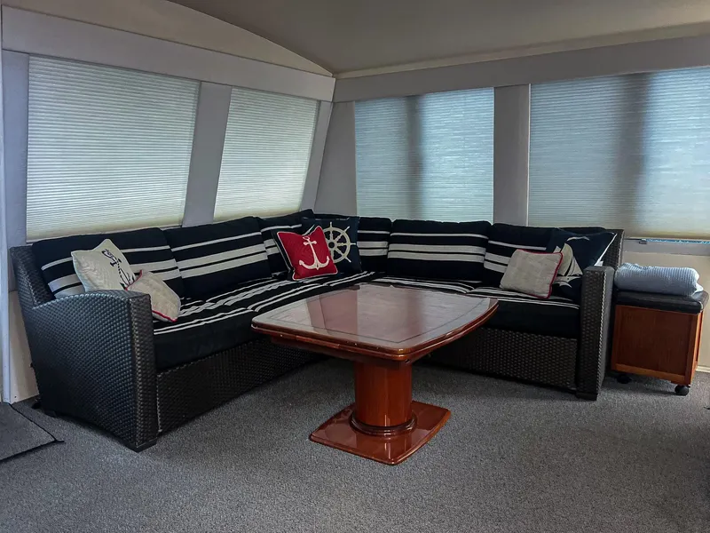 Slide: The Image of Luxurious interior of 1996 Viking 60 Cockpit Sport Yacht with elegant seating and nautical decor. - 37