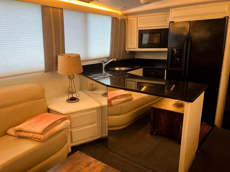 Slide: The Image of Luxurious interior of a 1996 Viking 60 Cockpit Sport Yacht with modern kitchen amenities. - 40
