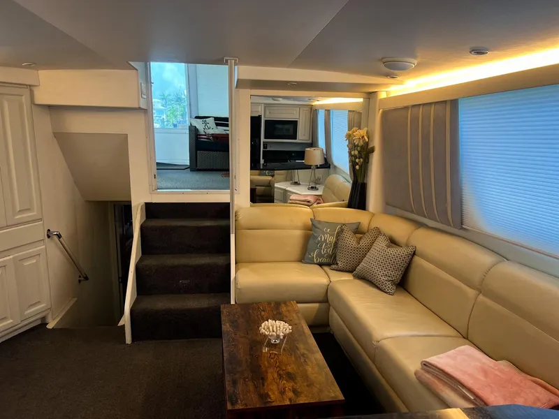 Slide: The Image of Luxurious interior of a 1996 Viking 60 Cockpit Sport Yacht with elegant seating and decor. - 42