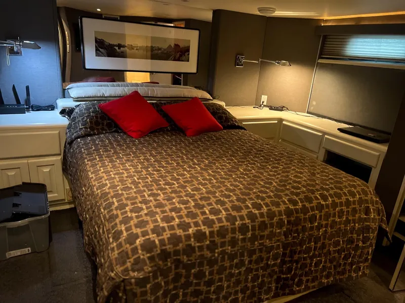 Slide: The Image of Luxurious bedroom in a 1996 Viking 60 Cockpit Sport Yacht with modern decor. - 44