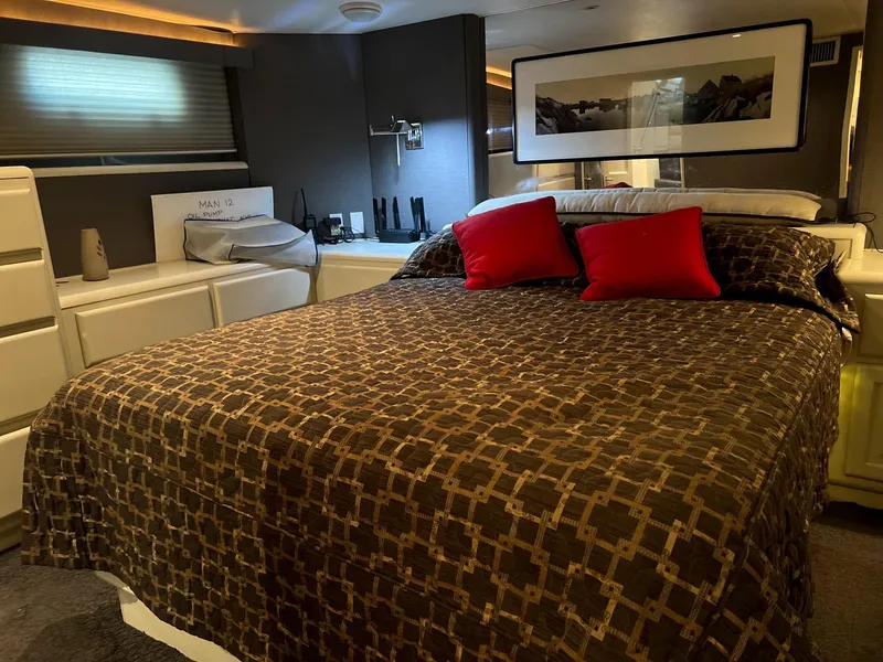Slide: The Image of Luxurious bedroom interior of 1996 Viking 60 Cockpit Sport Yacht with modern decor. - 45