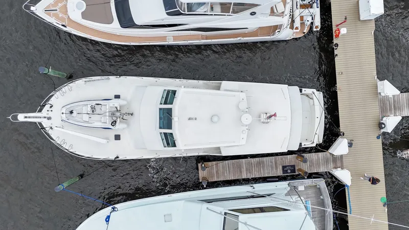 Slide: The Image of Overhead view of a 1996 Viking 60 Cockpit Sport Yacht docked at a marina. - 5
