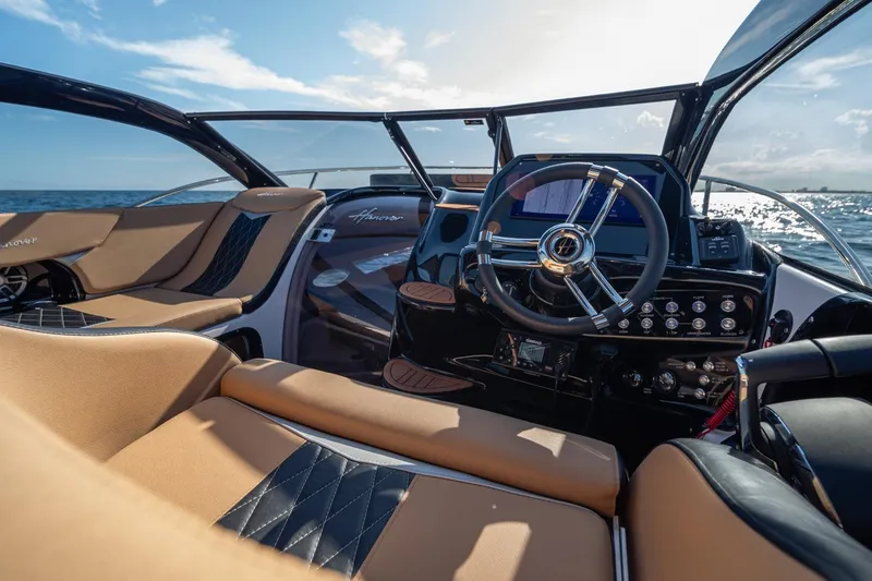 Slide: The Image of Luxurious interior of 2026 Hanover 305 boat with modern steering and seating. - 17