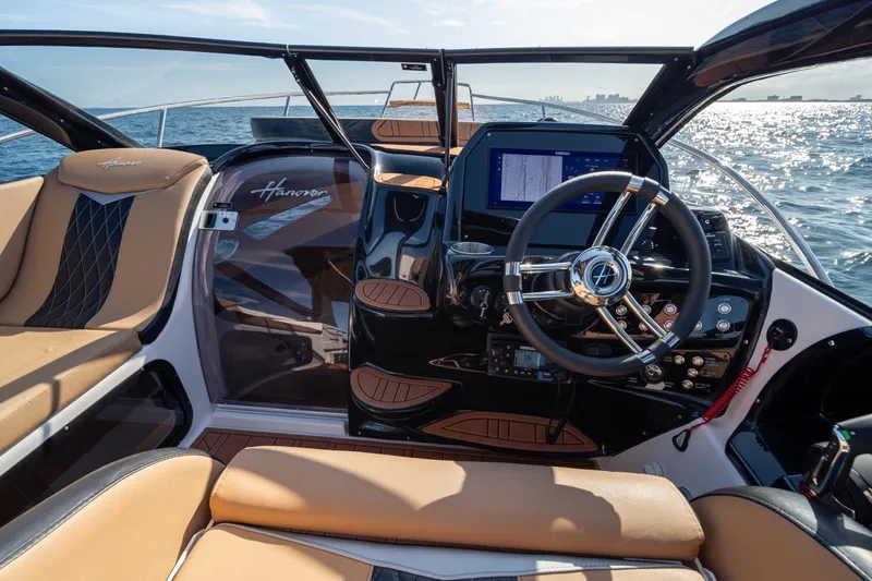 Slide: The Image of Interior of 2026 Hanover 305 boat with modern steering and navigation system. - 18