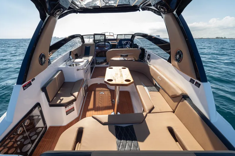 Slide: The Image of Luxurious 2026 Hanover 305 boat interior with elegant seating and ocean view. - 24
