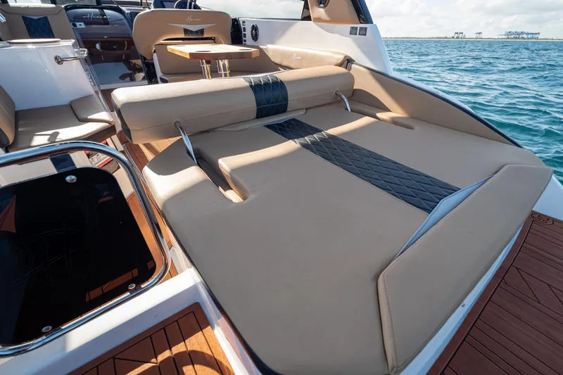 Slide: The Image of Luxurious 2026 Hanover 305 boat interior with elegant seating and ocean view. - 25