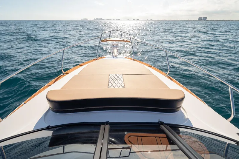 Slide: The Image of Front view of 2026 Hanover 305 boat cruising on open sea. - 27