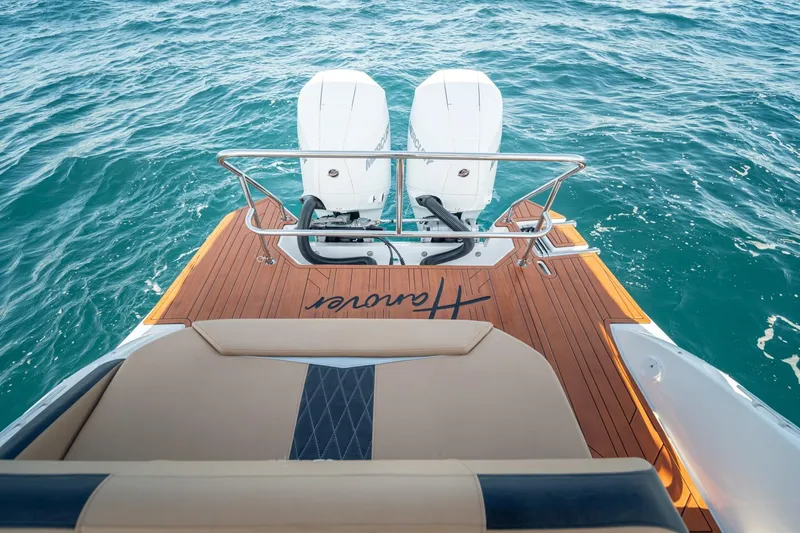 Slide: The Image of Luxury Hanover 305 boat deck with twin engines, 2026 model, on open water. - 28