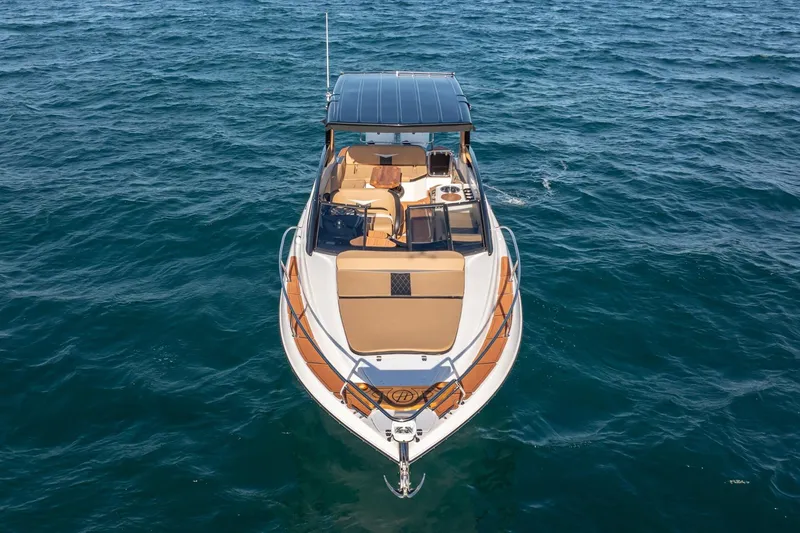 Slide: The Image of 2026 Hanover 305 boat on open water, featuring sleek design and spacious deck. - 3