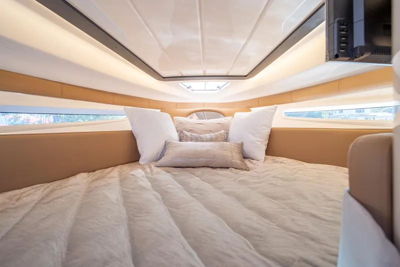 Slide: The Image of Luxurious cabin interior of 2026 Hanover 305 yacht with plush bedding and ambient lighting. - 31