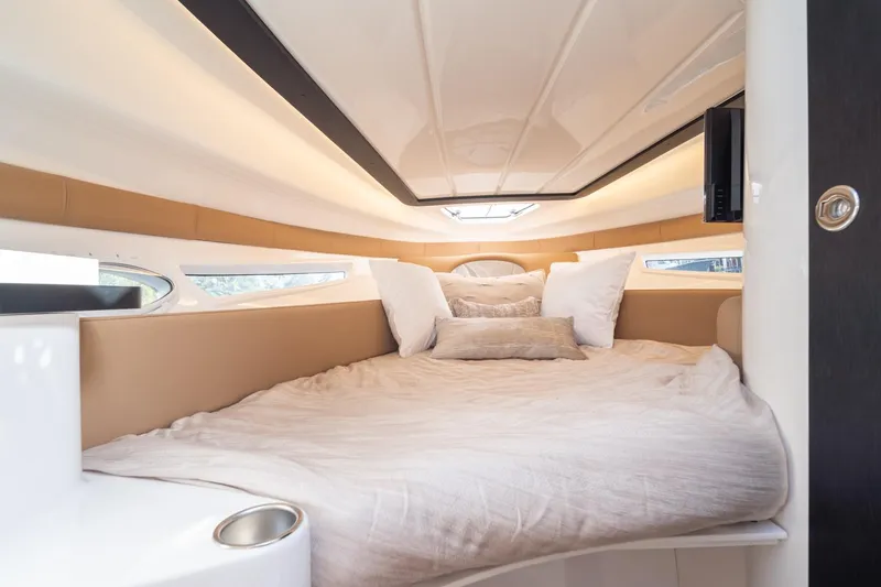 Slide: The Image of Luxurious interior cabin of 2026 Hanover 305 boat with cozy bedding. - 32