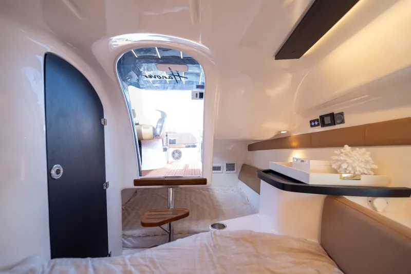 Slide: The Image of Interior of 2026 Hanover 305 boat cabin with modern design and cozy seating. - 33
