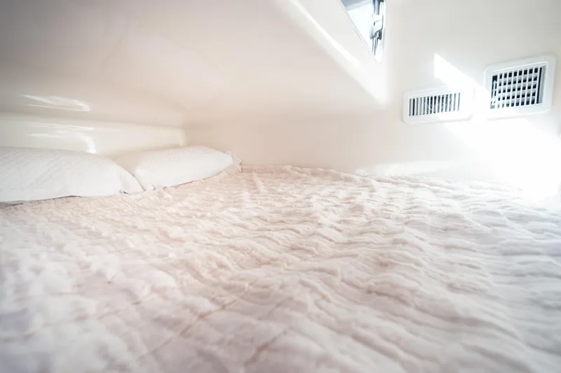 Slide: The Image of Interior of Hanover 305 (2026) RV with cozy bed and soft lighting. - 35