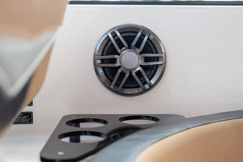 Slide: The Image of Speaker and cup holder in 2026 Hanover 305 boat interior. - 37