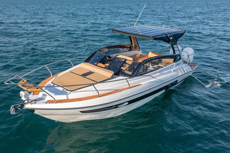 Slide: The Image of 2026 Hanover 305 boat cruising on open water, featuring sleek design and modern amenities. - 4