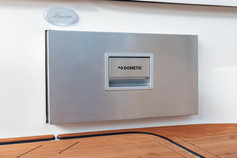 Slide: The Image of Hanover 305 boat with Dometic panel, 2026 model, featuring sleek design and wooden deck. - 41