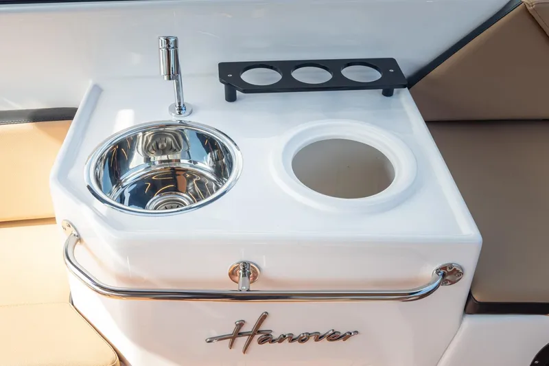 Slide: The Image of 2026 Hanover 305 boat sink and cup holder setup, featuring sleek design and functionality. - 47