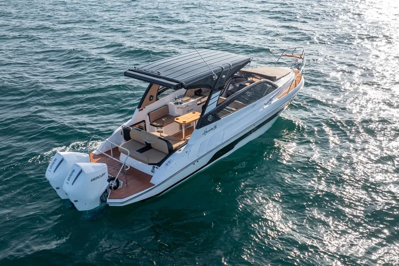 Slide: The Image of Aerial view of 2026 Hanover 305 boat cruising on open water. - 8