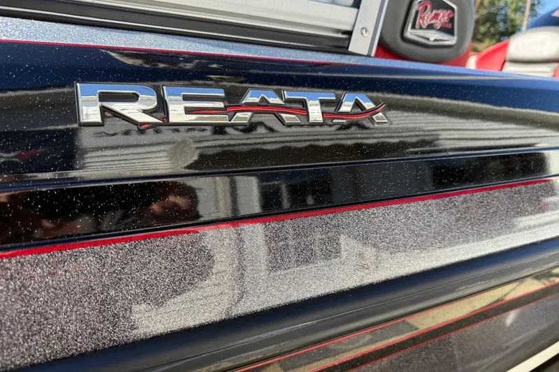 Slide: The Image of 2023 Ranger 1850 Reata boat with metallic finish and Reata logo detail. - 14