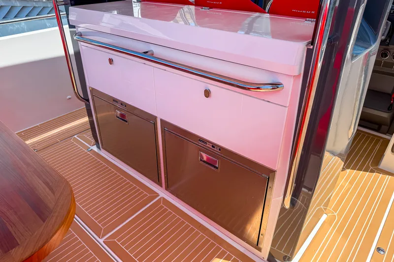 Slide: The Image of Interior view of 2025 Nimbus Tender 11 yacht, featuring sleek cabinetry and modern design. - 9