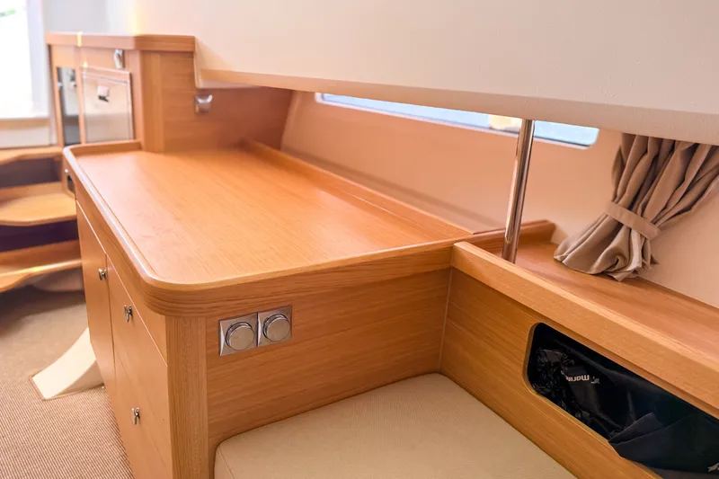 Slide: The Image of Interior of 2025 Nimbus Tender 11, featuring sleek wooden cabinetry and modern design elements. - 18