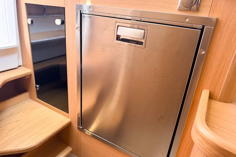 Slide: The Image of Stainless steel appliance in 2025 Nimbus Tender 11 boat interior. - 21