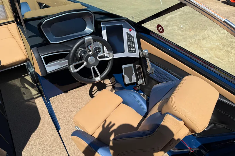 Slide: The Image of 2019 MasterCraft X26 boat interior with steering wheel and control panel. - 4