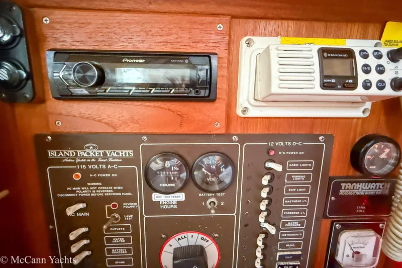 Slide: The Image of Control panel of a 1989 Island Packet 31 yacht with radio and gauges. - 42