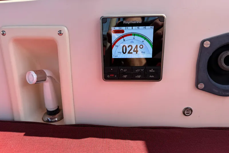 Slide: The Image of Raymarine display on 1989 Island Packet 31 sailboat, showing 024° heading. - 48